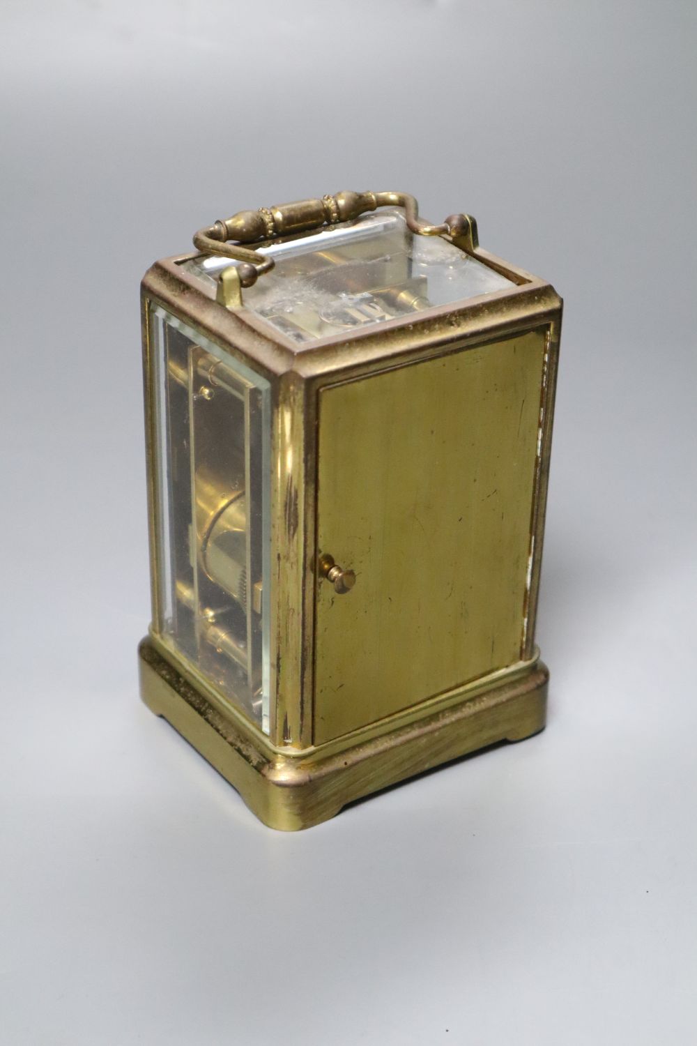 O. Berger, Paris. A carriage clock, with white enamel dial, Japy Freres movement striking on a bell, 19cm incl. handle